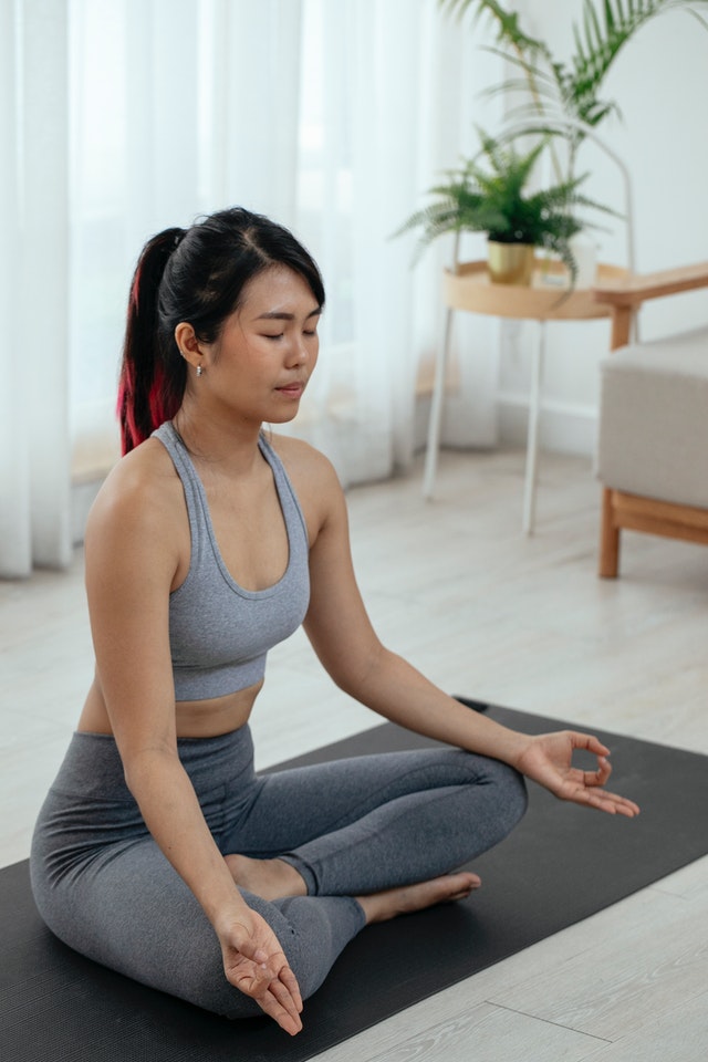 Woman meditating in lotus pose